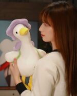 Kawaii Molly the Little Flower duck plushie toy held by a person.