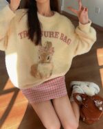 Vintage bunny aesthetic sweater featuring a soft, cream-colored knit with a bunny design and "Treasure Bag" text.