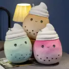 Set of bubble tea plushies in various pastel colors with straw accents.