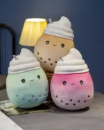 Set of bubble tea plushies in various pastel colors with straw accents.