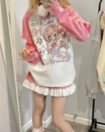 Pink kawaii t-shirt with anime character print, showcasing a cute core aesthetic outfit.