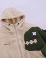 Harajuku dino hoodie featuring a fluffy beige sherpa design with green dinosaur accents.