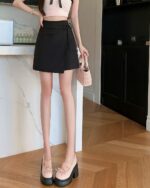 Black lace-up korean fashion skirt with wrap detail, showcasing a stylish and trendy silhouette.