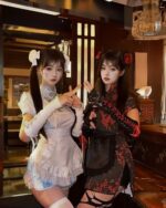 Two women wearing a maid hanfu dress, inspired by traditional Hanfu, posing for the camera.