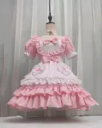 Unisex japanese maid dress in pink and white, kawaii aesthetic, frilled details on the skirt and sleeves.