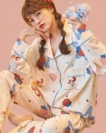 Strawberry lamb pajamas featuring a kawaii print with strawberries and sheep. Kawaii pajamas.