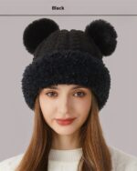Black bear ears hat knitted winter hat worn by a woman.