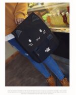 Black kawaii neko backpack, school edition, showing details and design.