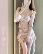Four-piece kawaii aesthetic swimsuit with floral print bra and bottoms.