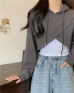 Gray korean aesthetic hoodie featuring a cropped, layered design with a hood.