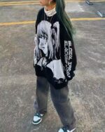 Black Harajuku animecore sweater featuring a detailed anime illustration print and layered aesthetic.