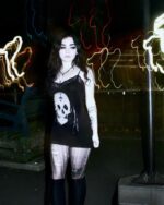 Black gothic aesthetic dress with a skull print, featuring a lace trim and spaghetti straps.