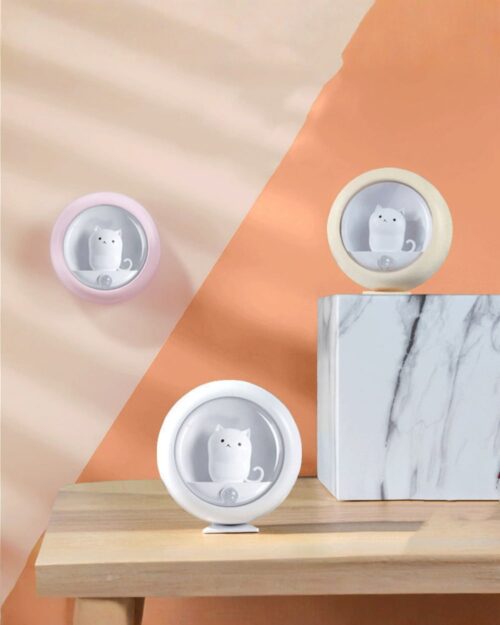 Two kawaii cat lamps displayed on a marble surface, body-activated night light.