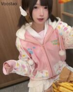 Pink harajuku hoodie with playful animal and star print design.