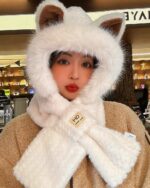 Fluffy fox ear beanie, a brown and white hooded winter hat with faux fur trim.