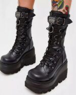 Black y2k punk boots featuring platform soles, lacing, and buckles for a gothic look.