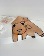 Cartoon animal scarf featuring a cute brown bear design, an animal winter scarf.