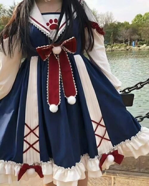 Close-up of a blue and white sweet lolita dress with bows and ruffles.