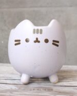 Cute Pusheen flower pot, kawaii ceramic planter with face details.