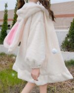 Fluffy bunny ears coat in a soft, cream-colored plush material with attached bunny ears and hood.