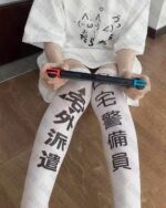 Kawaii thigh highs featuring a kanji inscription on the leg.