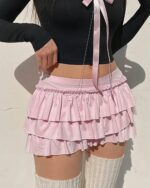 Bowed pink ruffled coquette aesthetic skirt with elastic waistband and satin tie.