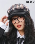 Retro plaid beret, a french aesthetic beret, worn by a woman.