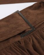 Close-up of an aesthetic vintage skirt with brown suede and a black buckle.