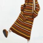 Long vintage aesthetic dress with multi-colored stripes and a hooded design.