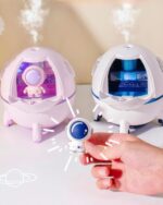 Kawaii Mini Spaceship Humidifier showing controls and a small astronaut figurine.