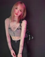 Mesh pattern witchcore long sleeve top featuring celestial and sun motifs on a sheer layer.