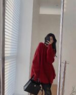 Red Korean style sweater worn by a person in a mirror reflection.