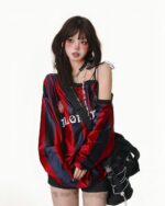 Off shoulder sport sweatshirt featuring a coquette aesthetic design with red and blue stripes.