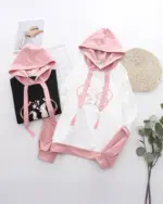 Two Sakura Bunny hoodies, one pink and one black, featuring embroidered bunnies and tassels. Product keyword: sakura bunny hoodie