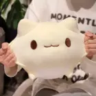 Close-up of a white round neko plushie with visible eyes and mouth.