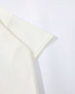 Cream-colored short-sleeved cat graphic tee, kawaii style.