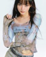 Oil paint mesh print top featuring an artsy aesthetic design with layered textures and typography.