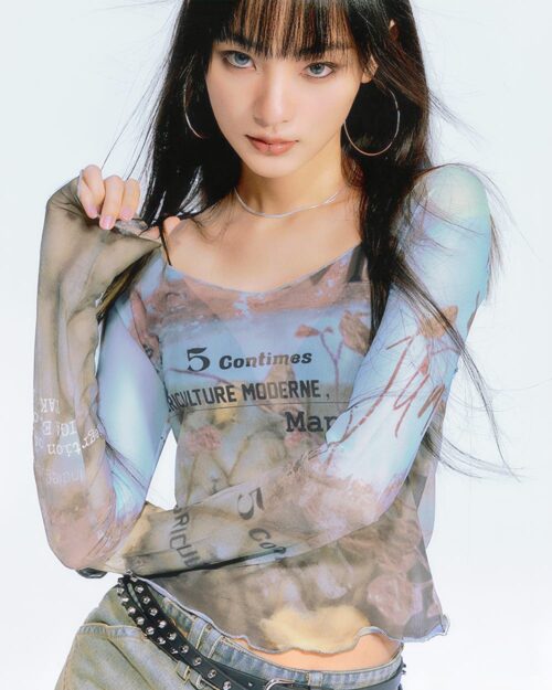 Oil paint mesh print top featuring an artsy aesthetic design with layered textures and typography.