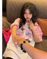 A pink t-shirt with a kawaii kitty design, Kitty Pink T-Shirt.