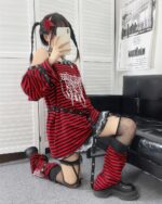 Red and black punk lolita set with corset, lace trim, and fishnet stockings.