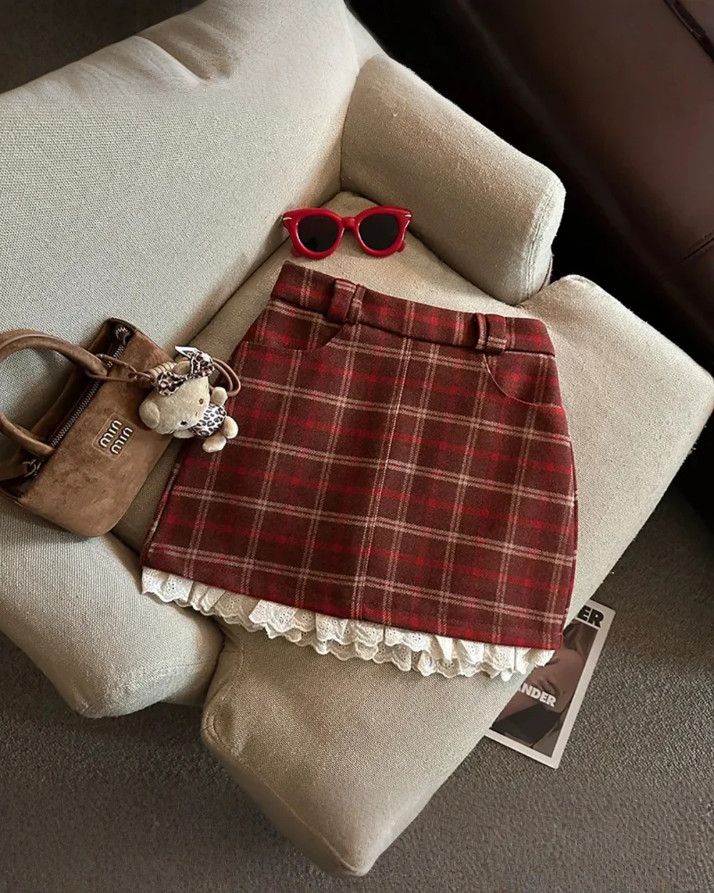 Red plaid mini skirt with lace trim, a preppy aesthetic skirt.