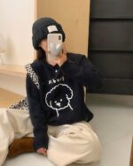 Black puppy doodle sweater with a cute dog graphic on a knit sweater.