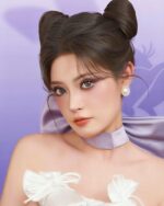 Woman wearing a white coquette bow choker with pastel purple makeup and hairstyle.