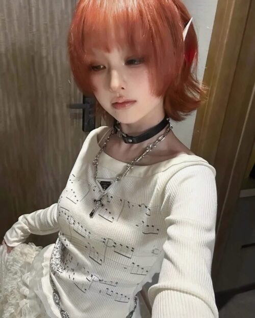 Model wearing a Thin Long Sleeve Top featuring musical print design.