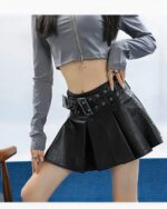 Black vegan leather punk skirt with multiple buckles and a pleated design.