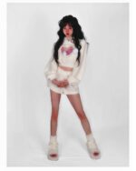 Model wearing a white kawaii fluffy pajamas set, featuring a cropped top and shorts.
