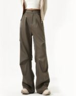 Rivet Design Loose Pants - Korean aesthetic pants, wide-leg style, neutral tone.