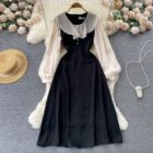 Black puff sleeve french aesthetic dress, featuring a high collar and full skirt.