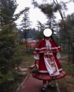 Red Cape Puffy Dress - Classic Lolita Aesthetic, worn outdoors in a garden setting.
