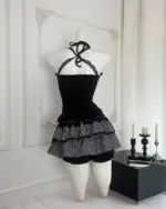 Black ruffled mini dress from the dark gyaru set, Gothic Lolita aesthetic.